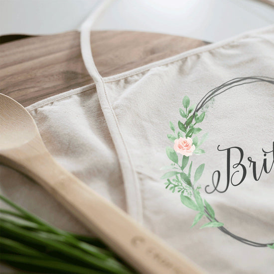 Load image into Gallery viewer, Greenery Wreath Apron | Personalized Grey Kitchen Apron | Custom Apron | Kitchen Apron | Custom Monogram Apron | Cotton Canvas Full Apron
